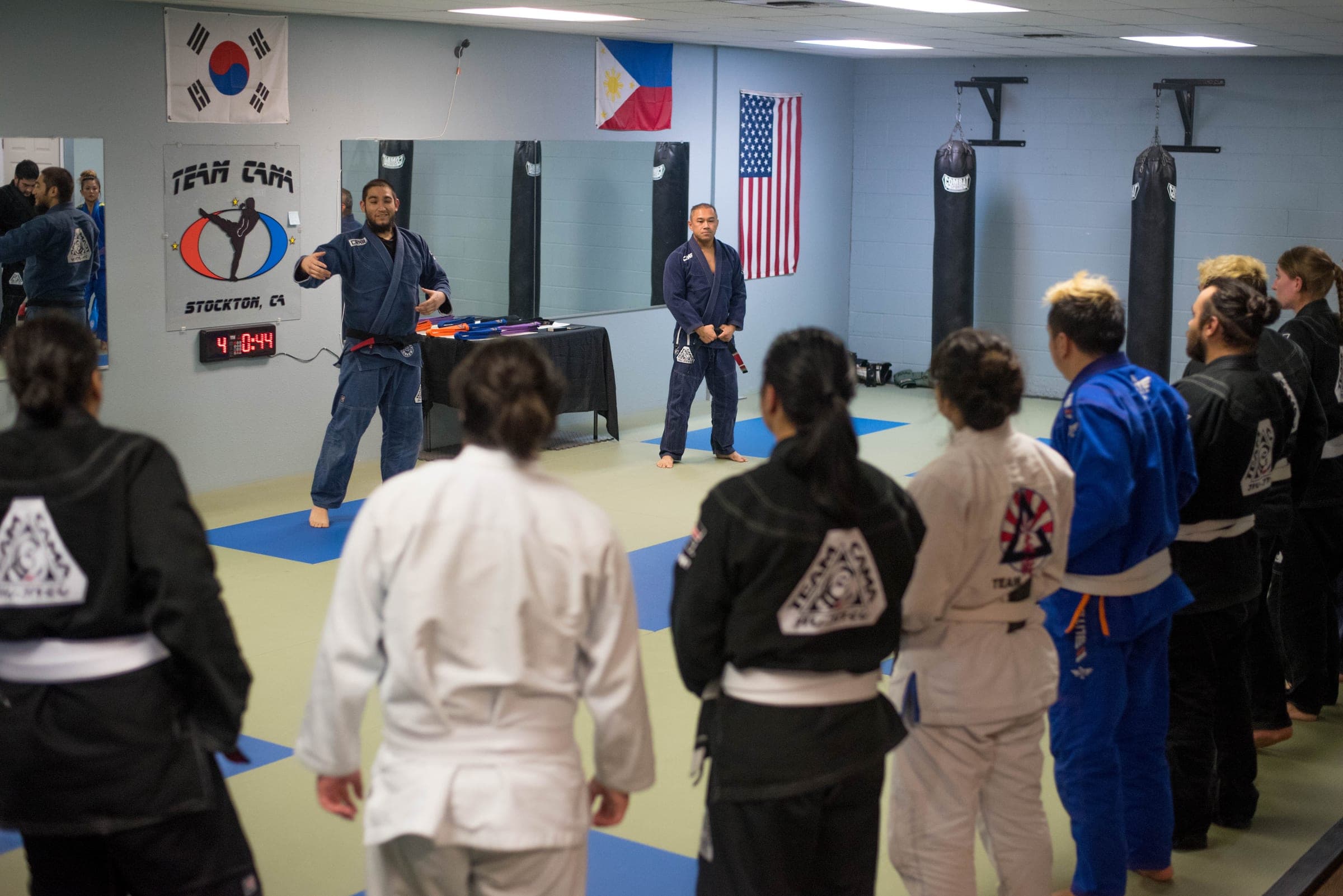Students and instructors together on the mats at Team Cama